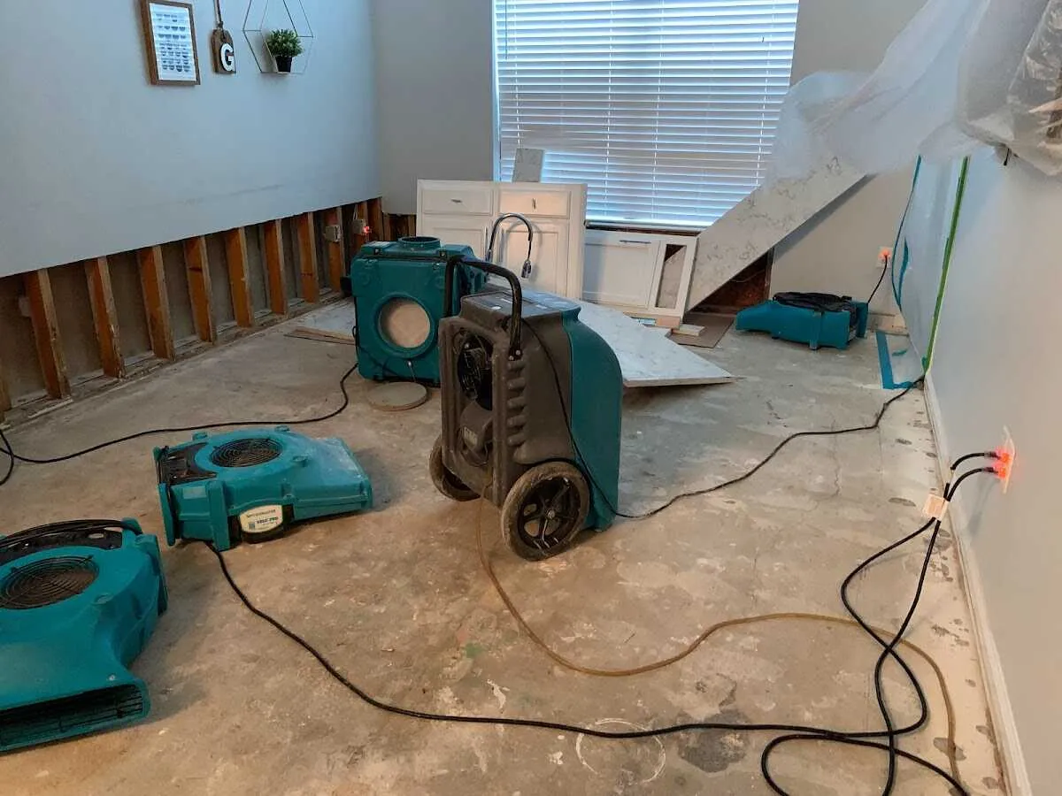 Dehumidifier in flood-cut room for Water Damage Restoration in Chillum
